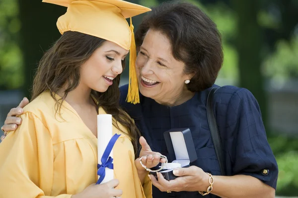 Graduate Receiving Gift from Grandmother — Stock Photo, Image