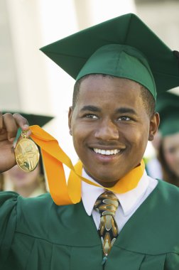 Graduate Holding Medal clipart