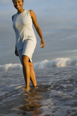 Woman Wading in the Ocean clipart