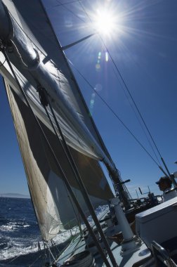 Rigging and Mast of yacht on ocean clipart