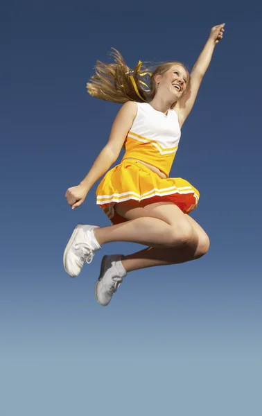 Cheerleader jumping mid-air — Stock Photo, Image