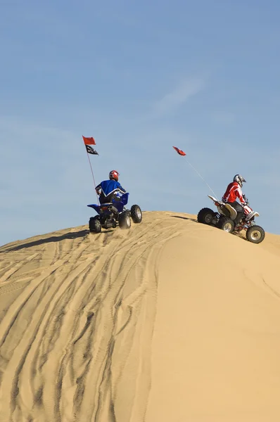 Men riding quad bikes — Stock Photo, Image