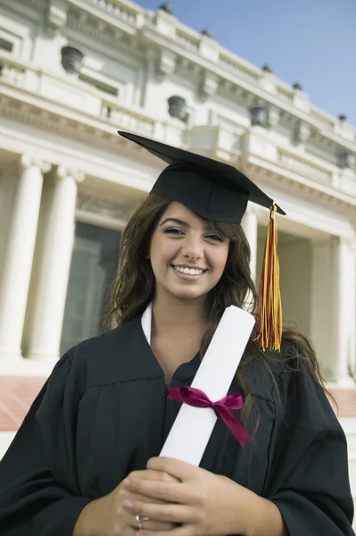 Graduate holding diploma — Stock Photo, Image