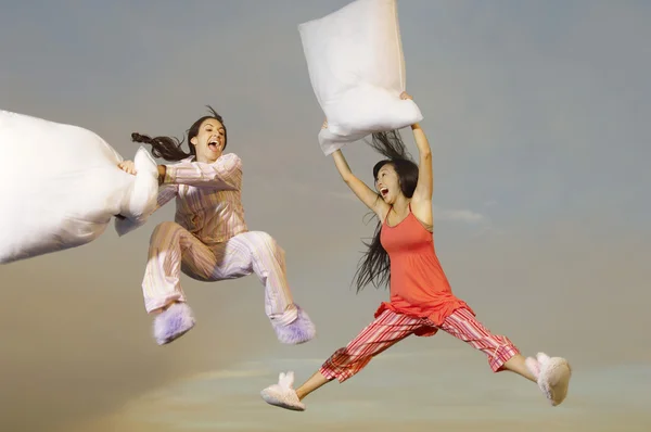 Women having pillow fight — Stock Photo, Image