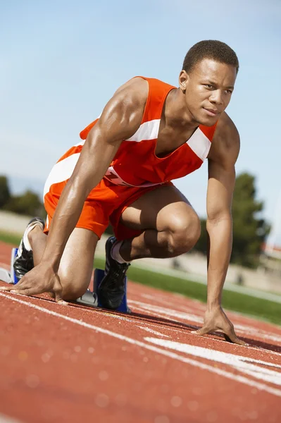 Male runner waiting at the starting — Stock Photo, Image