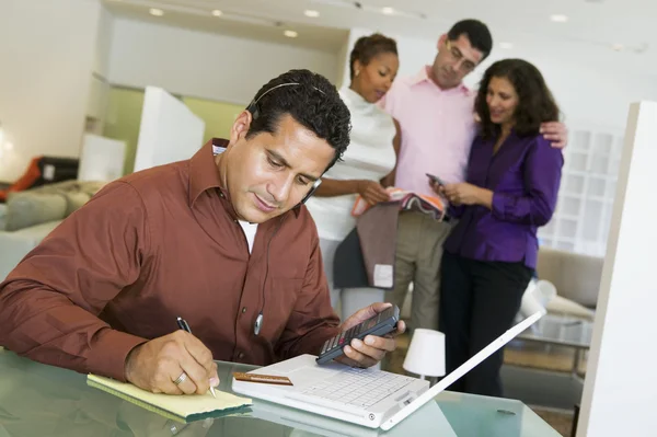 Man adding figures with calculator laptop — Stock Photo, Image