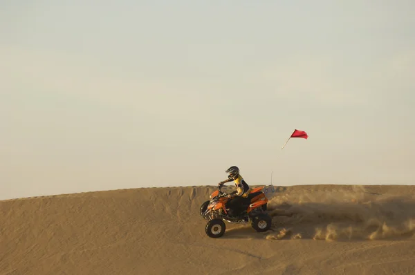 Young man riding ATV — Stock Photo, Image