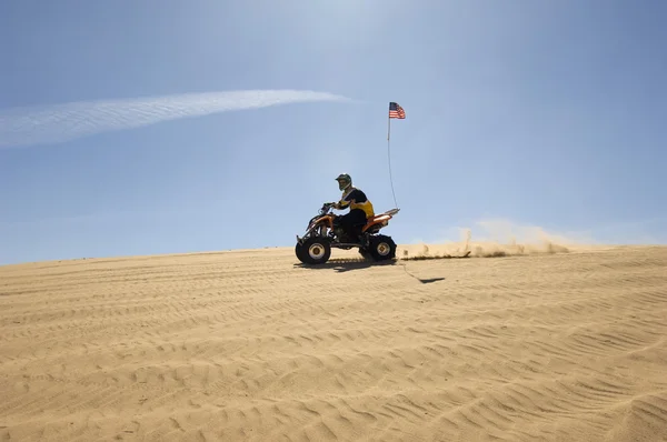 Young Man Riding ATV Over Sand Dune — Stock Photo, Image