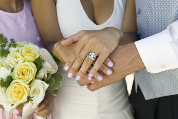 Bride's Hands and Wedding Ring
