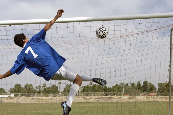 Young man scoring goal — Stock Photo, Image