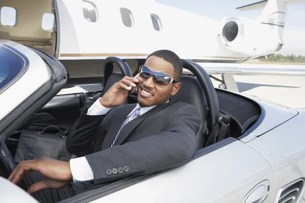 Businessman in convertible — Stock Photo, Image