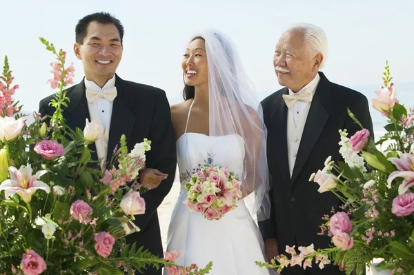 Bride and groom with father — Stock Photo, Image