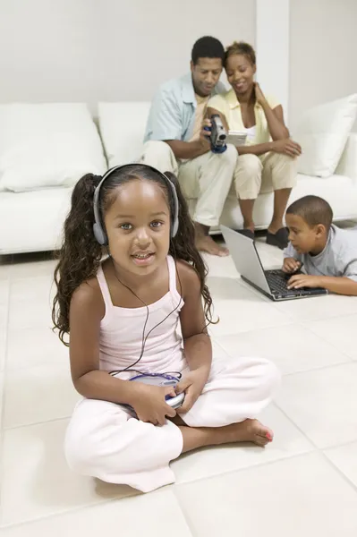 Girl sitting Listening to Music — Stock Photo, Image