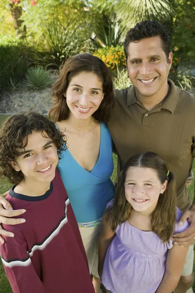 Girl with brother and parents — Stock Photo, Image