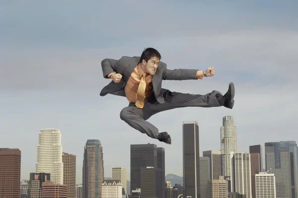 Businessman doing martial arts — Stock Photo, Image