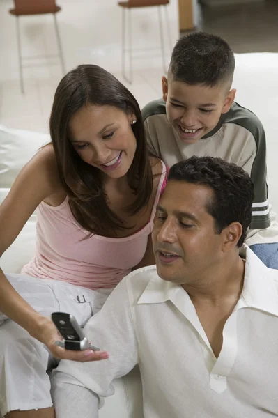 Family looking at picture — Stock Photo, Image