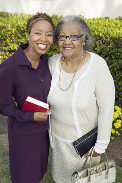 Daughter and Mother with Bibles — Stock Photo, Image