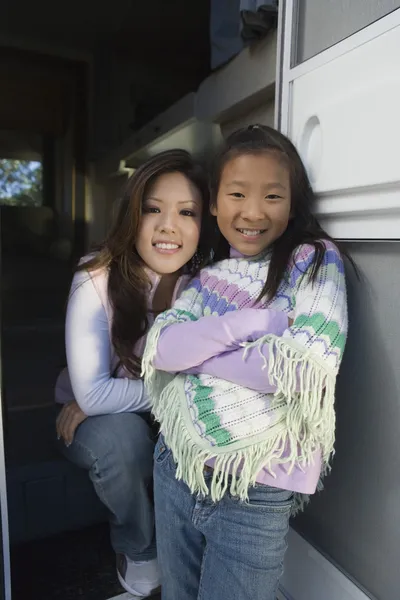 Sisters standing inside RV — Stock Photo, Image