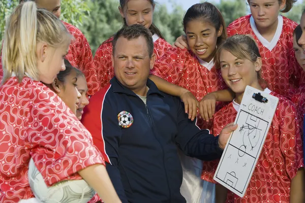 Coach holding clipboard — Stock Photo, Image