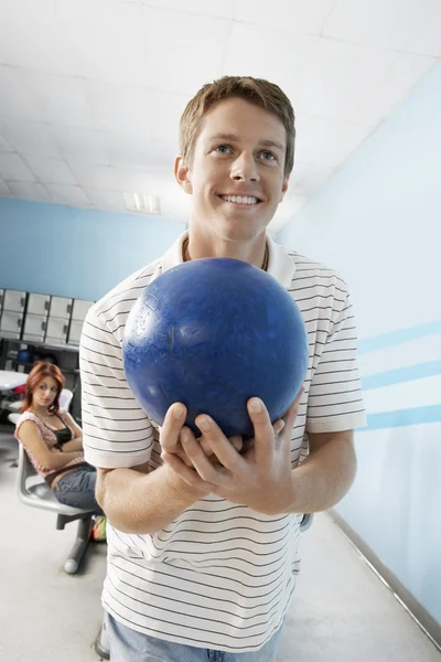 Man at bowling alley Stock Photo