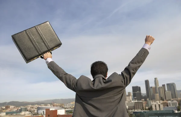 Business man cheering to city — Stock Photo, Image