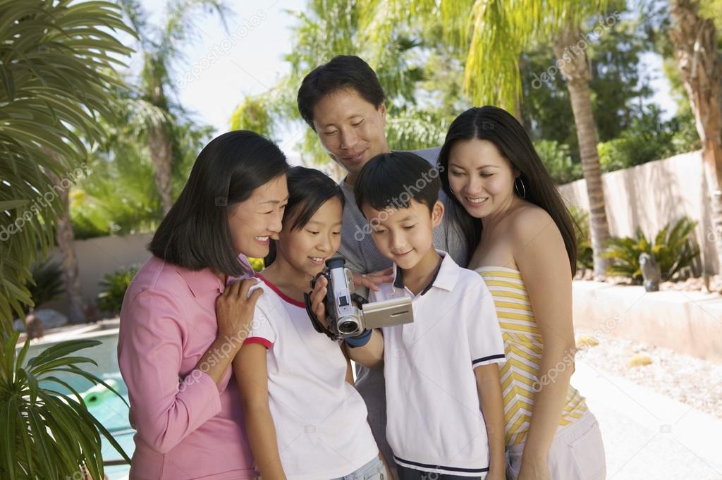 Family Looking at Video Camera