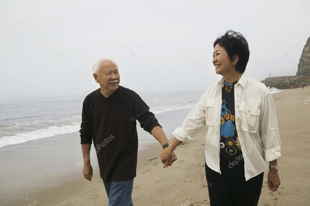 Mature couple holding hands