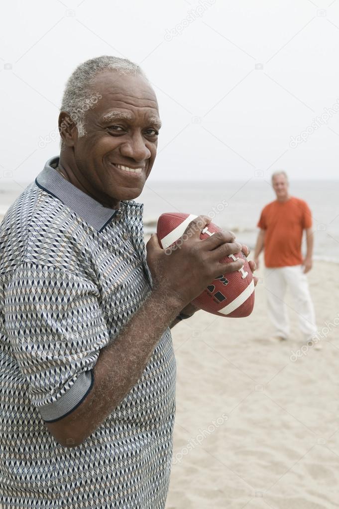 Senior men playing american football
