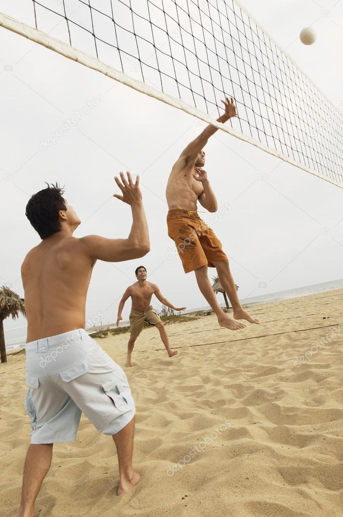 Man in Mid-air Going for Volleyball