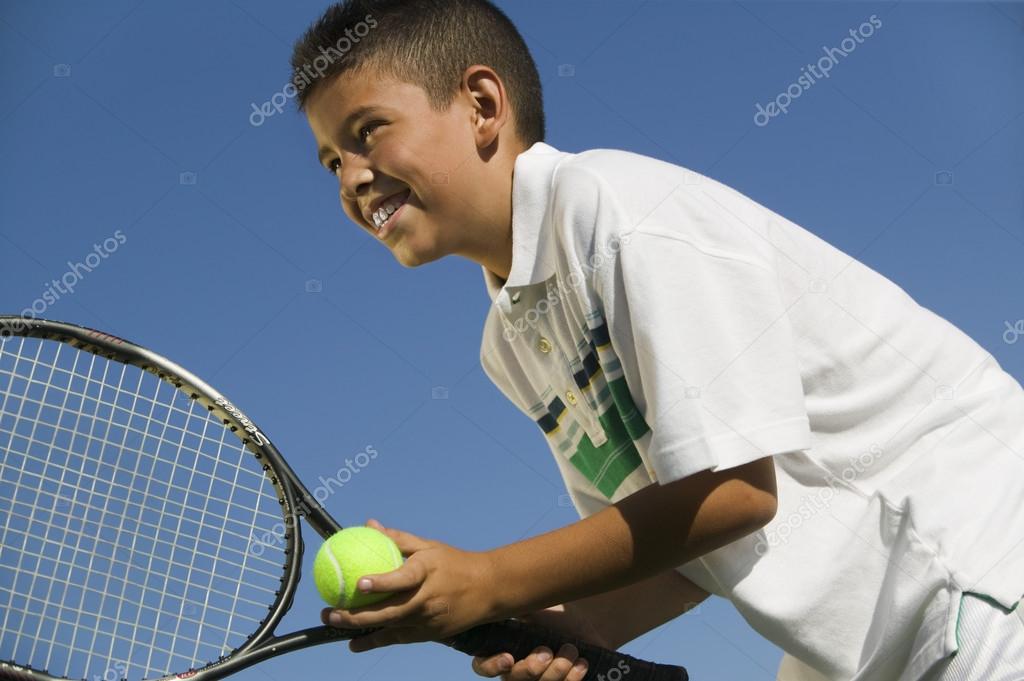 Boy on tennis court