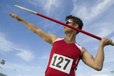 Athlete about to throw javelin clipart