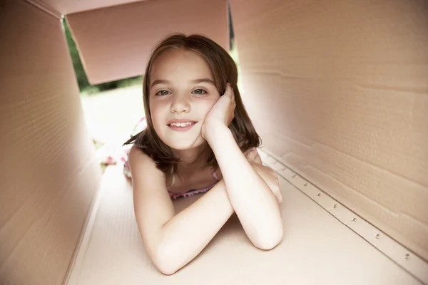 Girl in cardboard box — Stock Photo, Image