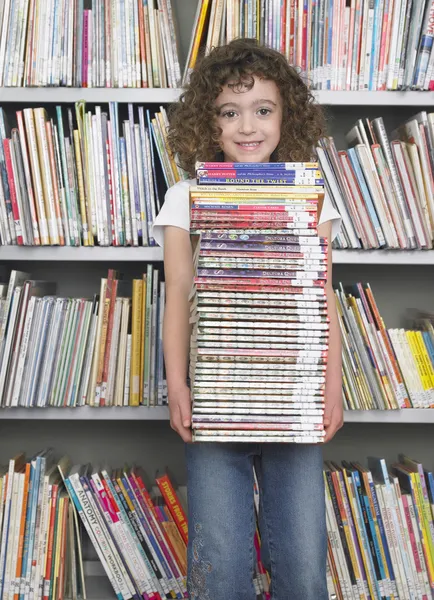 Girl holding books — Stok fotoğraf