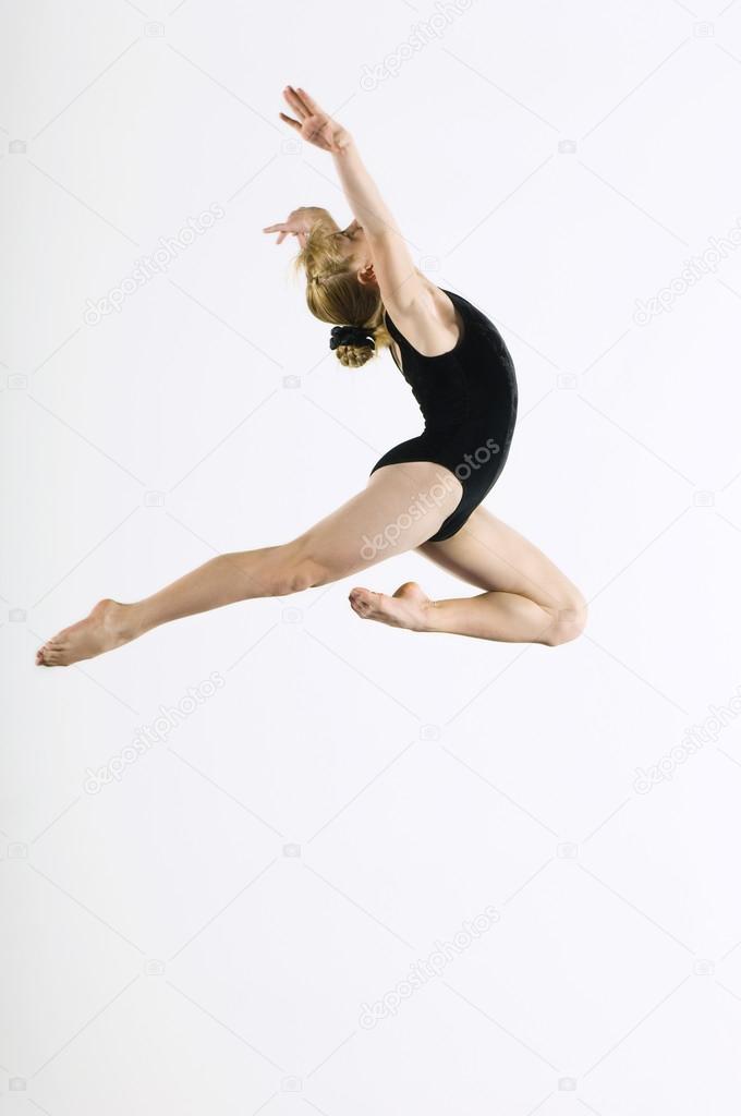 Gymnast leaping in air