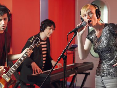 Band in recording studio