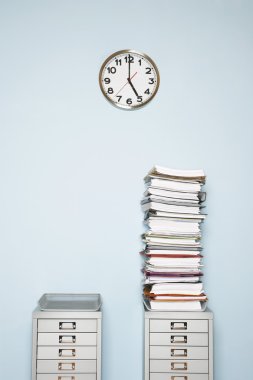 Office wall with clock and paperwork clipart