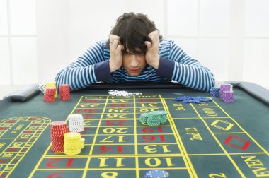Frustrated man at roulette table clipart