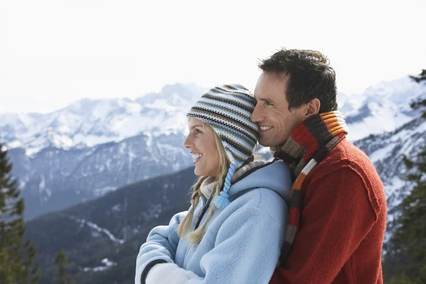 Couple in warm clothing standing — Stock Photo, Image