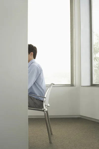 Businessman sitting in office — Stock Photo, Image