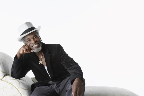 African Man on Chaise Lounge — Stock Photo, Image