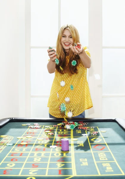 Woman celebrating on roulette — Stock Photo, Image