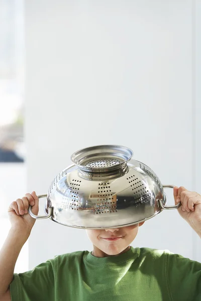 Playful boy with colander — Stock Photo, Image