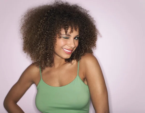 Woman with Curly Hair winking — Stock Photo, Image