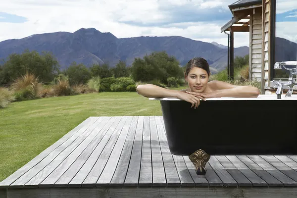 Woman taking bath on porch — Stock Photo, Image