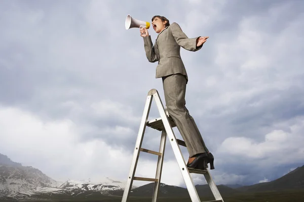 Businesswoman shouting Through Megaphone — Stock Photo, Image