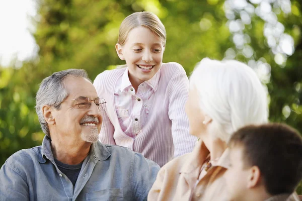 Grandparents with Grandchildren in park — Stock Photo, Image