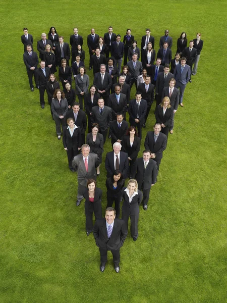 Business people standing in triangle formation — Stock Photo, Image