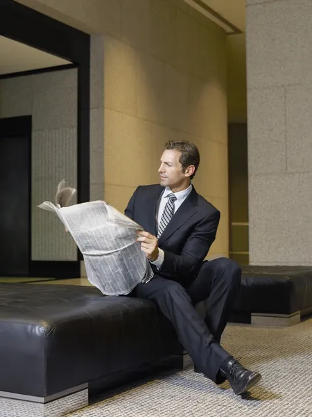 Businessman reading newspaper — Stock Photo, Image