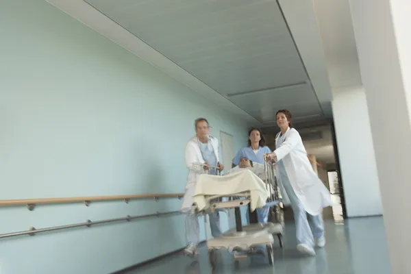 Physicians Rushing Patient on gurney — Stock Photo, Image