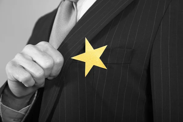 Ondernemers met gouden ster op pak — Stockfoto